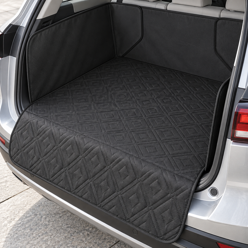 Black quilted trunk liner covering the cargo floor, side walls and rear seat back with bumper flap lowered