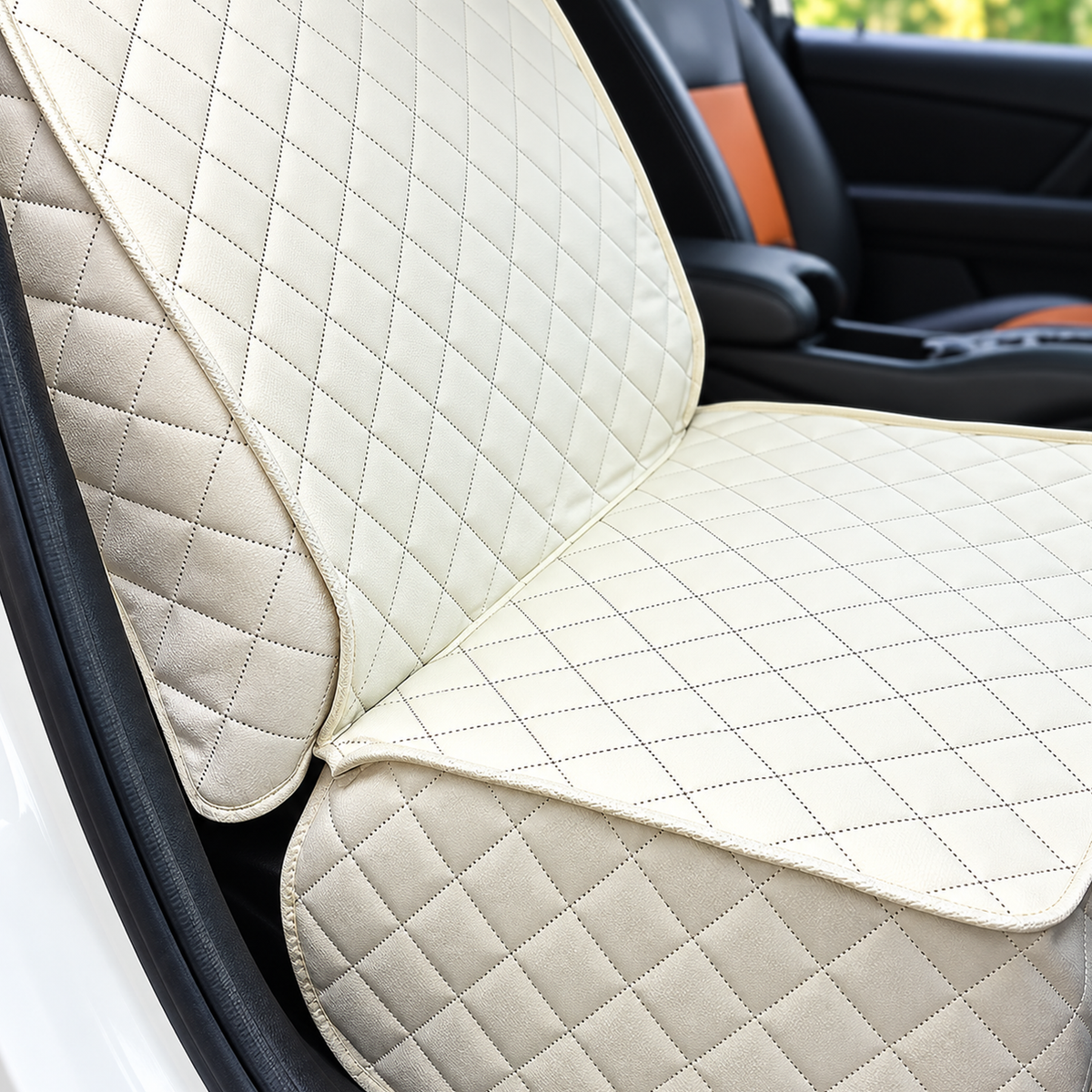Detail view of the Ivory quilted pet car seat cover showing stitched diamond panels and bound edges - Ravzelo